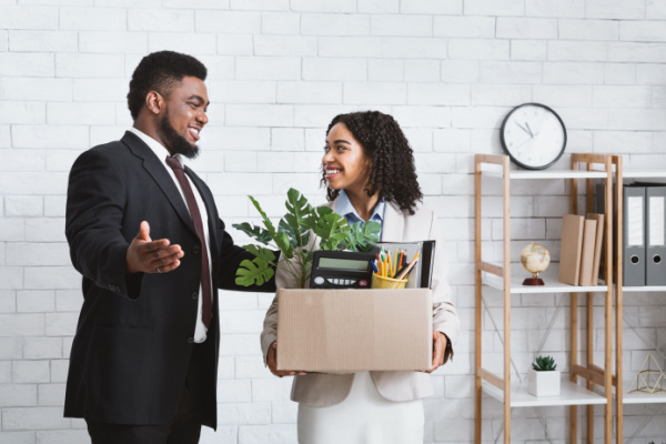 A young person being welcomed into an office