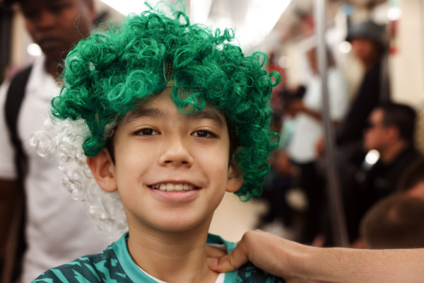 A young Saudia Arabia football fan in the metro