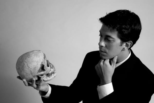 A man holding a skull like Hamlet