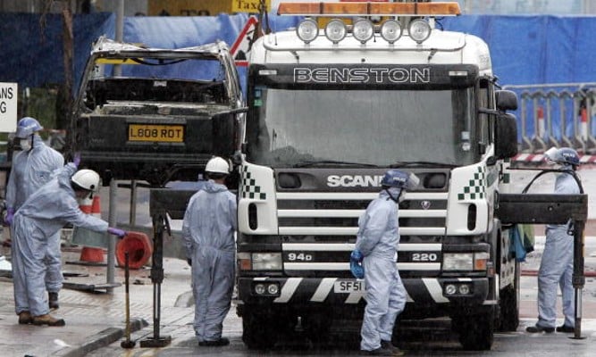 The remain's of the burnt out jeep is lifted from the scene at Glasgow International Airport after the 2007 attack