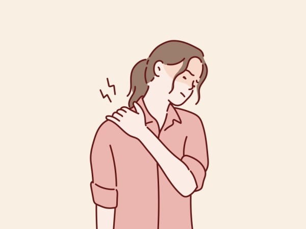 Illustration of a woman in pain holding her shoulder