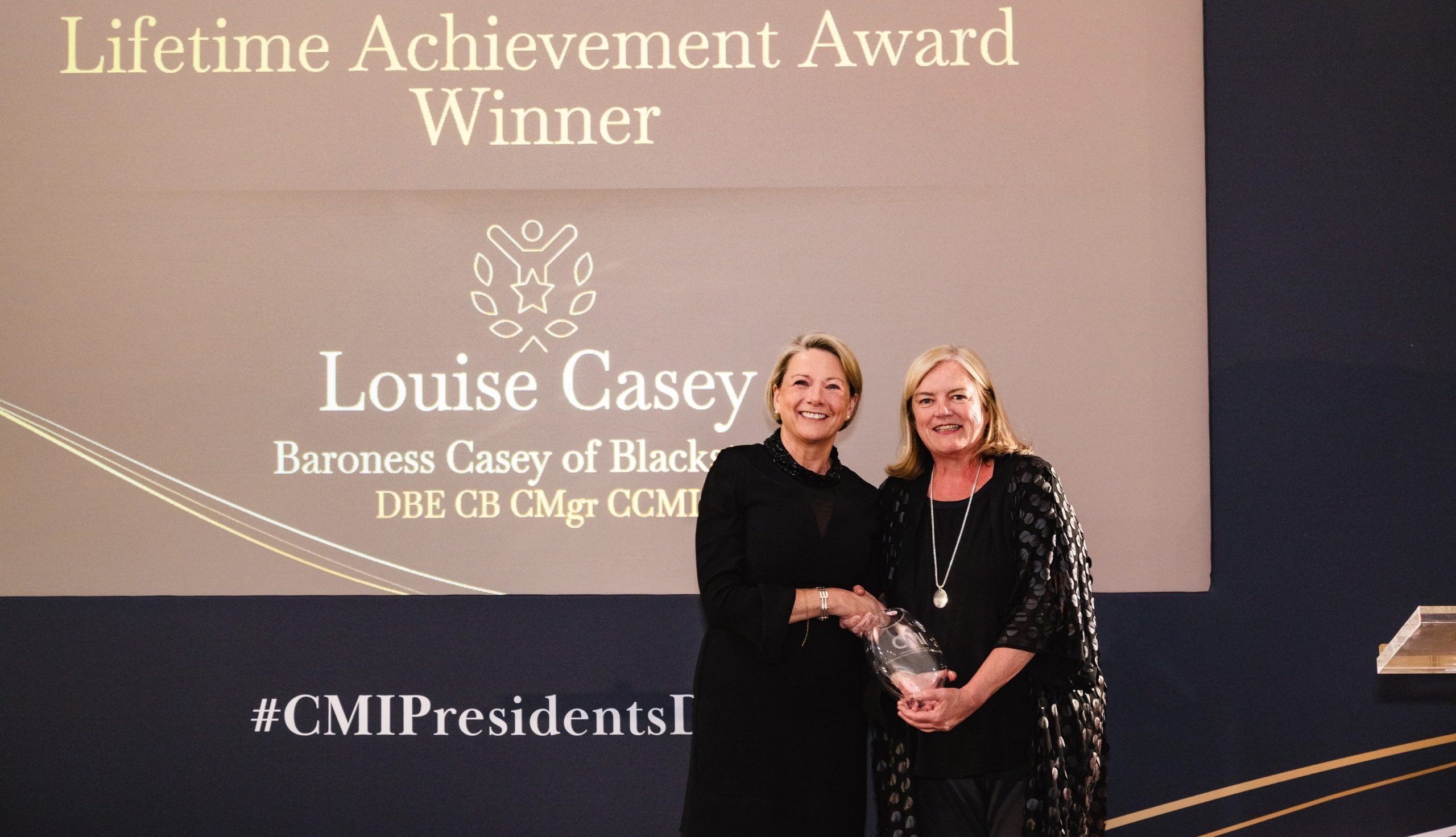Baroness Louise Casey receiving reward from Fiona Dawson at CMI Presidents Dinner