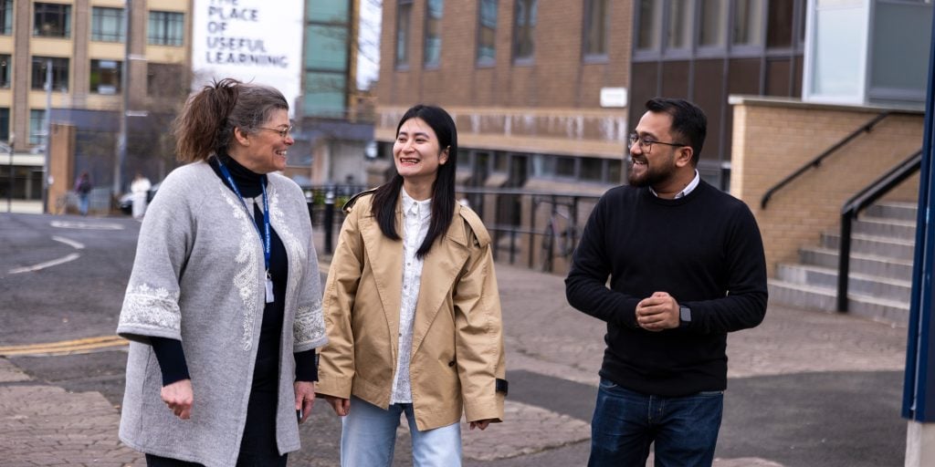 Three people in conversation