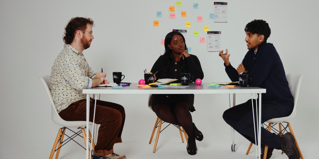 Three people in conversation