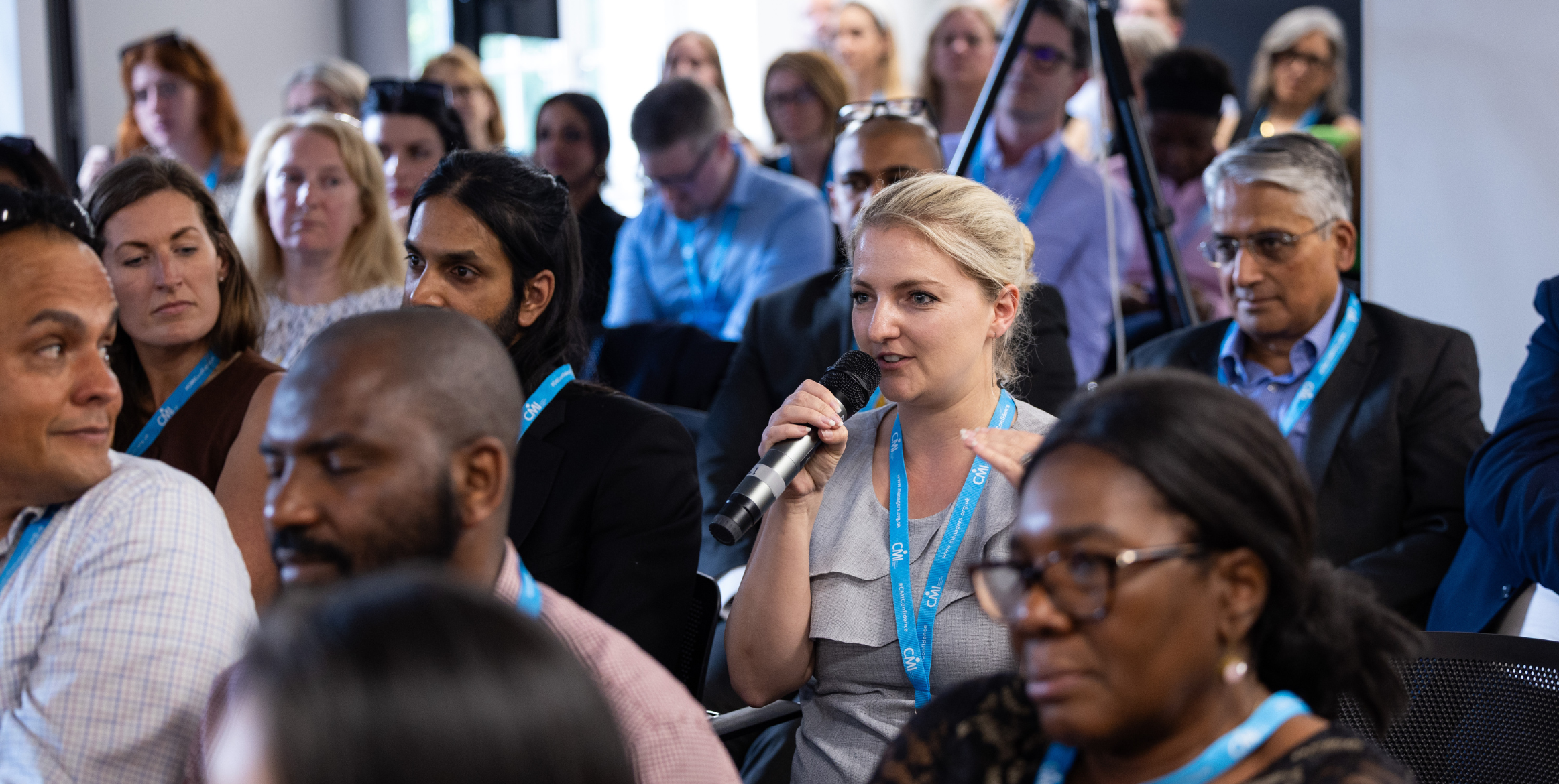 A member asking a question at a CMI event.