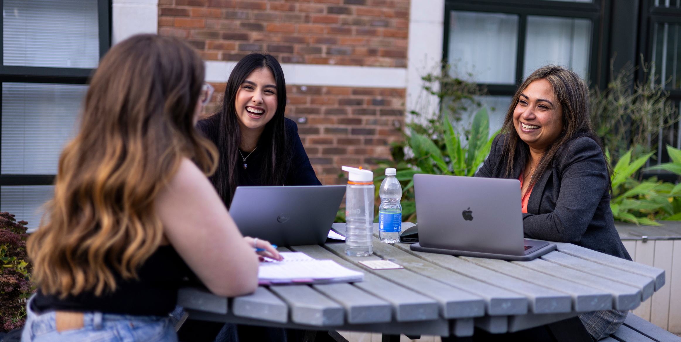 Colleagues conversing outside