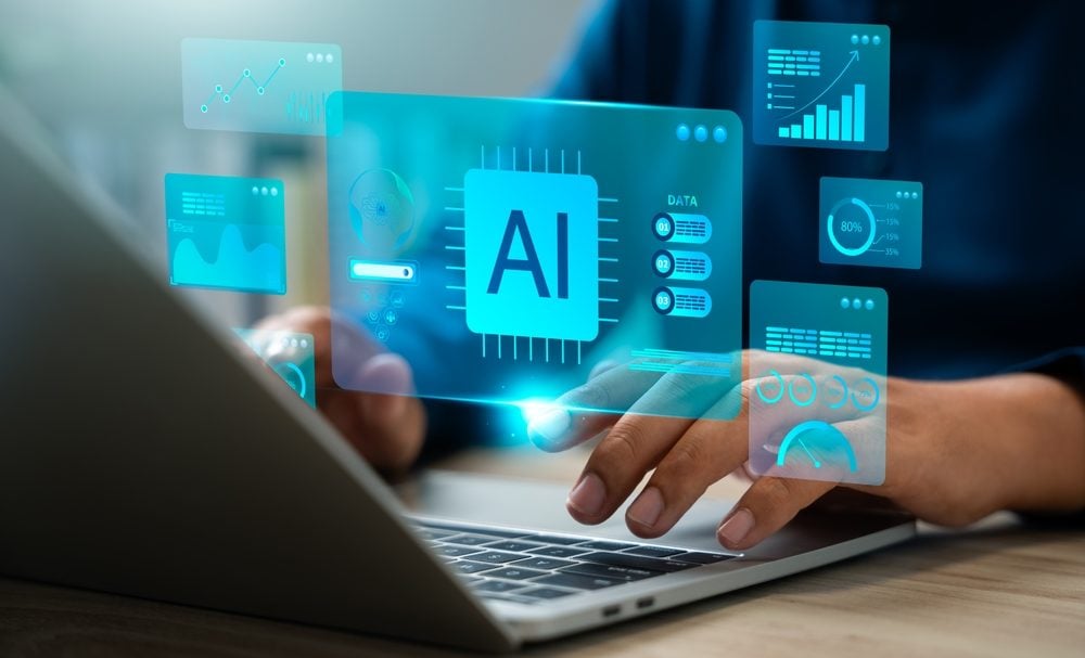 Person working with AI on laptop