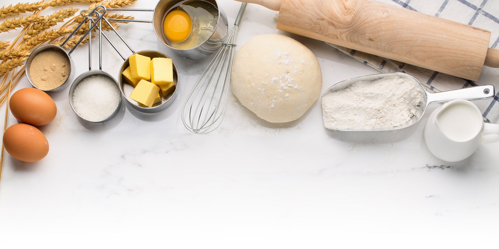 A spread of different baking ingredients and utensils