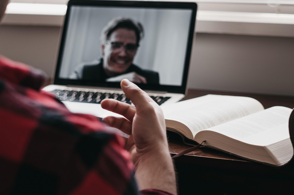 Person making a video call on a laptop