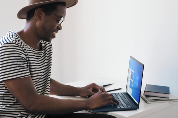 Man on laptop at desk